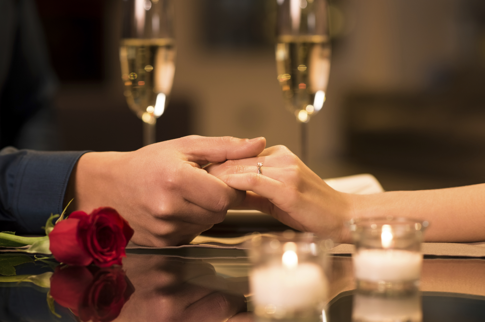 Couple holding hands Epic Events by Booth, Inc. - Event Planning - Engagement Party