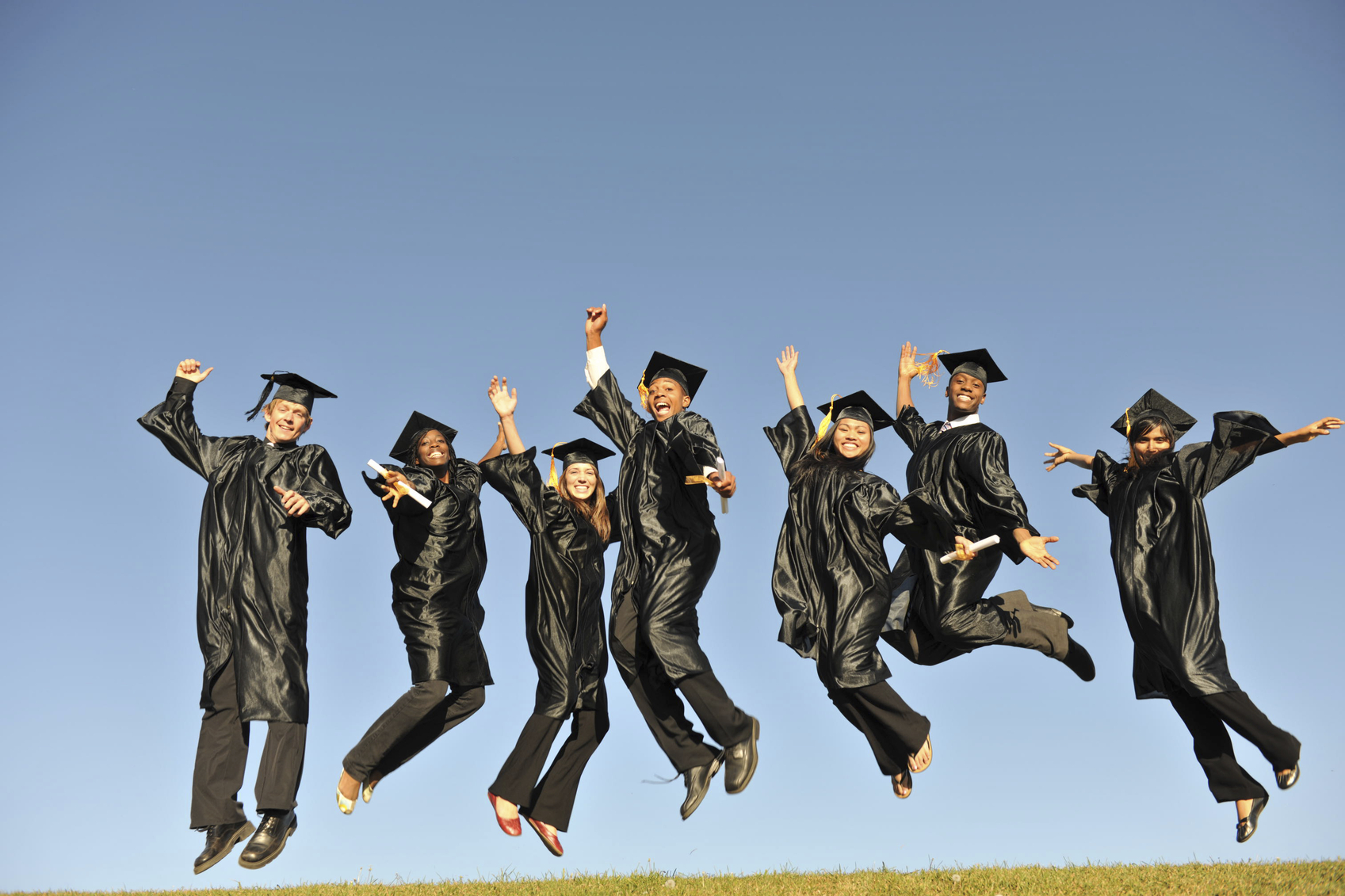 Graduates Jumping in the Air Epic Events by Booth, Inc. - Event Planning - Graduation Party